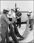 Coast Guard Officer and Workers with Chevron Deploy Apparatus for Pollution Remediation, Tampa, Florida, B by George Skip Gandy IV