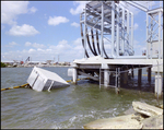 Side View of a Damaged Pier or Dock with Debris Floating in the Water, Tampa, Florida, A by George Skip Gandy IV