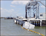 Side View of a Damaged Pier or Dock with Debris Floating in the Water, Tampa, Florida, B by George Skip Gandy IV