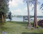 Lakeside Dock and Boat Beside Mound of Construction Dirt in Tampa, Florida, B