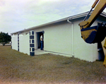 Backhoe beside House, A by George Skip Gandy IV