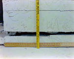 Close Up of Yardsticks against Crack in Foundation, B by George Skip Gandy IV