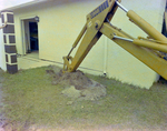 Backhoe Digging Trench beside House, B by George Skip Gandy IV