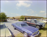 Bay Plaza Storefronts and Parking Lot, Tampa, Florida, G by Skip Gandy