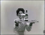 Woman Holding Tray of Tropical Beer by Skip Gandy