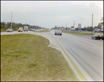 Cars Driving on a Road, J