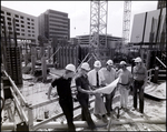 Men at a construction site, A