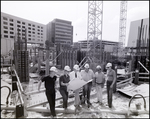 Men at a construction site, B