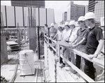 Men at a construction site, C