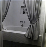 Tiled Bathtub with Two Tied-Back Shower Curtains in Tampa, Florida, B by Skip Gandy