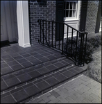 Brick Steps to Home Entryway with Wrought-Iron Handrails in Tampa, Florida, B by Skip Gandy