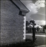 Corner of Brick Home with House Across Street in Distance, Tampa, Florida by Skip Gandy