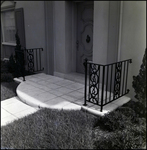 Stone Tile Walkway to Front Door with Wrought-Iron Border in Tampa, Florida, A by Skip Gandy