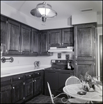 Kitchen with Frigidaire Electric Stove and Iron Dining Table in Tampa, Florida, B by Skip Gandy