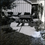 Patio with Outdoor Lounge Chairs and Picnic Table in Tampa, Florida, A by Skip Gandy