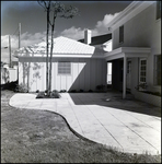 Landscaped Rear Patio Paved with Stone Tiles in Tampa, Florida, B by Skip Gandy