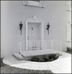 Front Door with White Roundabout Walkway and Wrought-Iron Handrail in Tampa, Florida, A by Skip Gandy