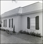 Side of Home with Landscaped Lawn and Windows with Shutters in Tampa, Florida, B by Skip Gandy