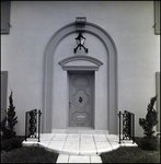 Front Door with Tiled Walkway and Large Lantern Overhead in Tampa, Florida, A by Skip Gandy