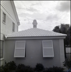 House Extension with Two Bahama Window Shutters and Tile Roof in Tampa, Florida, B by Skip Gandy