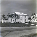 White Two-Story Home on Street Corner in Tampa, Florida, C by Skip Gandy