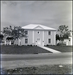 White Two-Story Home on Street Corner in Tampa, Florida, E by Skip Gandy