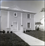 White Two-Story Home on Street Corner in Tampa, Florida, H by Skip Gandy