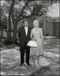 Couple Poses in Front of Model Home in Briarwood Neighborhood, Tampa, Florida, A by Skip Gandy