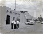 Three Men Outside J.C. Pressly and Co. in St. Petersburg, Florida by Skip Gandy