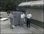 Three Men Chat Outside During Break at J.C. Pressly and Co. in St. Petersburg, Florida by Skip Gandy