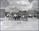 Men in Front of Stacked Lumber, Tampa, Florida by George Skip Gandy IV