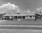 Suburban Home with Parents Magazine Award Sign by George Skip Gandy IV