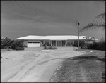 View of a Residential Home with Driveway by George Skip Gandy IV