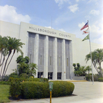 Hillsborough County Courthouse and Flags Beside It, Tampa, Florida, A by George Skip Gandy IV