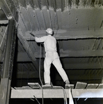 Construction Worker Spraying Insulation on Beams for Courthouse Annex, Tampa, Florida, A by George Skip Gandy IV