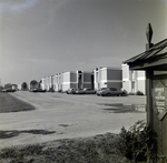 Apartment Complex with Cars Parked, A by George Skip Gandy IV