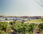 Parking Lot and Storefronts at Cypress Point Shopping Center, Winter Haven, Florida, A by George Skip Gandy IV