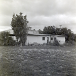 Small Building with Davis Island Hotel in the Background, Tampa, Florida, A by George Skip Gandy IV