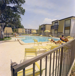 Residents Lounging by the Pool at Brookgreen Apartments, Clearwater, Florida, A by George Skip Gandy IV