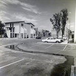 Cars Parked Near Apartment Buildings at Del Lago Apartments, Tampa, Florida, A by George Skip Gandy IV