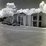 Parking Area with Cars in Front of Apartment Buildings at Del Lago Apartments, Tampa, Florida, B by George Skip Gandy IV