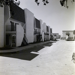 Row of Apartment Buildings with Parking Area at Del Lago Apartments, Tampa, Florida, B by George Skip Gandy IV