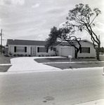 Residential House with Garage and Trees in Del Rio Estates, Tampa, Florida, A by George Skip Gandy IV