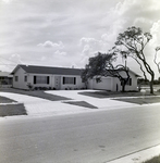 Residential House with Garage and Trees in Del Rio Estates, Tampa, Florida, B by George Skip Gandy IV