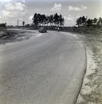 Curved Road with Cyclists and Car, Winter Park, Florida by George Skip Gandy IV