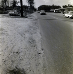 Cars Driving along a Paved Road with Adjacent Sandy Shoulder, Winter Park, Florida by George Skip Gandy IV