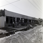 Damaged Building with Workers by George Skip Gandy IV