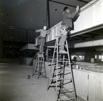 Side View of Workers Assembling Large Interior Framework, B by George Skip Gandy IV