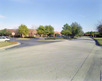 Brick Building with Parking lot and Roadway by George Skip Gandy IV