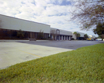 Industrial Building with Parking Lot and Loading Bays by George Skip Gandy IV